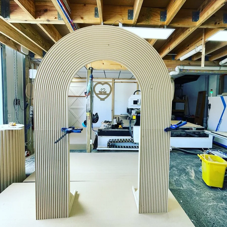 A fluted ripple arch standing on the workshop floor mid-build