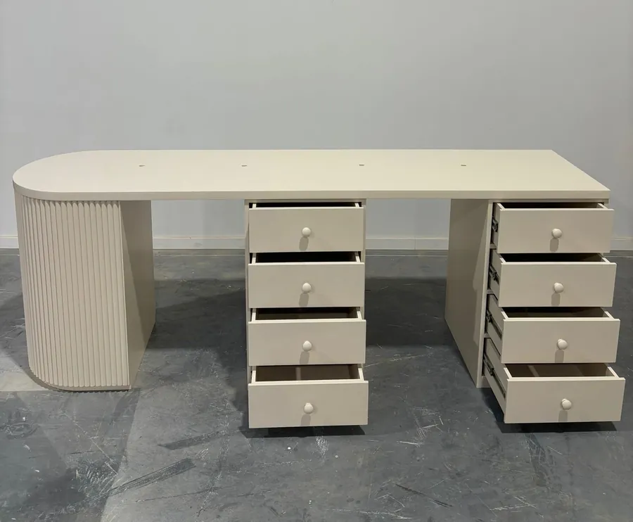Long cream salon work table with twin drawer banks