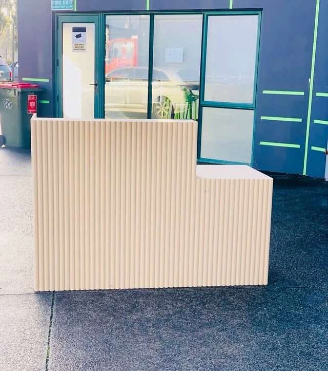 Cream stepped L-shaped reception counter