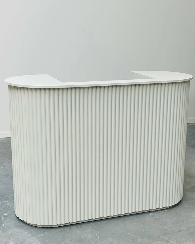 White fluted racetrack reception counter