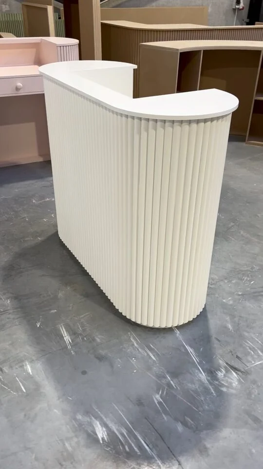 Small cream fluted counter finished and standing in the workshop