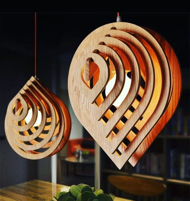 Parametric sliced-rib pendant lights hanging over a counter