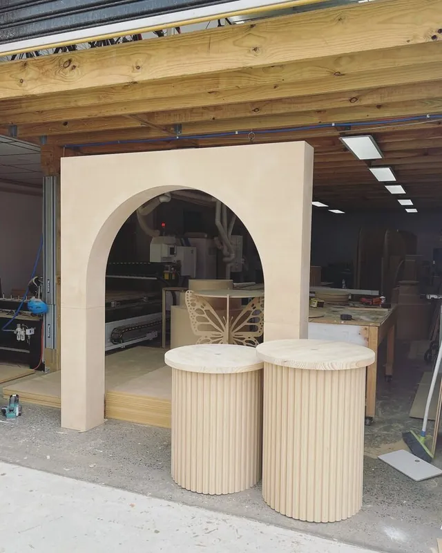 Retail arch alcove with matching fluted plinths in front