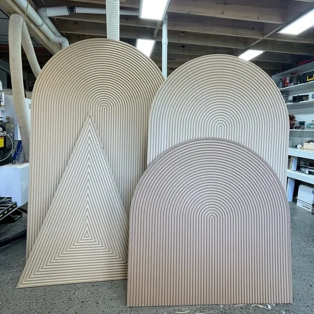 Arch and triangle shopfitting forms standing in the workshop